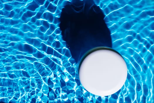 White plastic jar pot of facial and body cream gel collagen for anti aging wrinkles treatment. Water waving rippled. Professional spa relaxation moisturizer, healthy skin care. Flat lay, copy space.