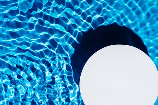 White circle copy space in transparent fresh blue water gel surface with flecks, waves, shade. Health care relaxation in summer beach. Vacation spa coast sea, natural concept. Flat lay. Place for text