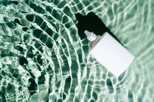 White beauty product sunscreen cream vial tube bottle in transparent fresh exhilarant wave green water with flecks, waves, shade. Advertising beauty cosmetology product concept. Flat lay. Copy space