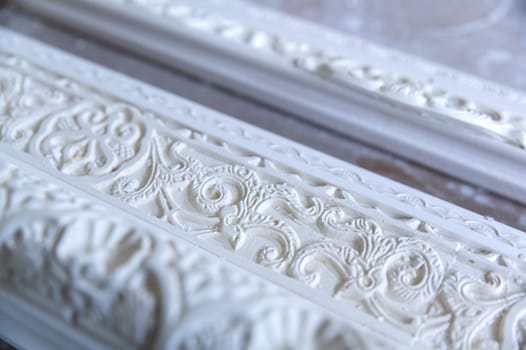 detail of the work of a supplier of frames, plaster sculptor