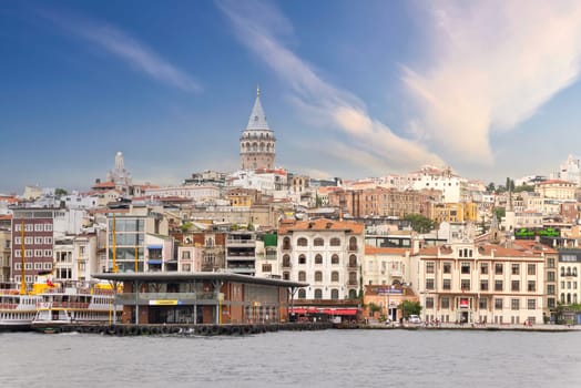 Istanbul, Turkey - August 25, 2022: City view of Istanbul skyline, from the Bosporous strait overlooking Galata Tower, Karakoy ferry terminal, and Istanbul Regional Port Authority