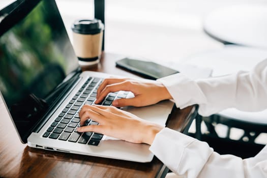 Asian young business woman lifestyle using laptop computer at cafe coffee shop, Happy beautiful freelancer typing keyboard on laptop, working online outside office
