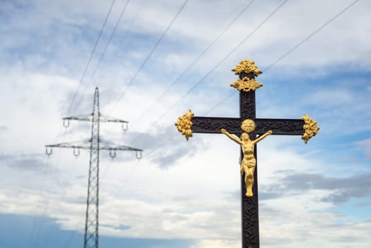 Sculpture Of Jesus Christ with electricity pylon