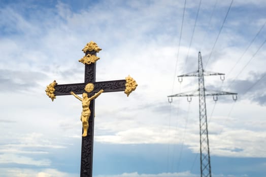 Sculpture Of Jesus Christ with electricity pylon