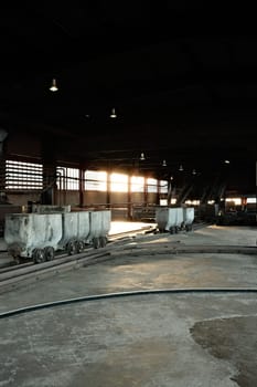 Coal lorries in a big hall in a mine in the Ruhr area, Germany