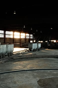 Coal lorries in a big hall in a mine in the Ruhr area, Germany