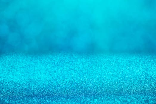 Blue bokeh background for christmas, defocused round lights and sunbeams, flare overlay
