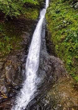 Whitelady waterfall in rain - Lydford Gorge, Dartmoor National Park, Devon, United Kingdom