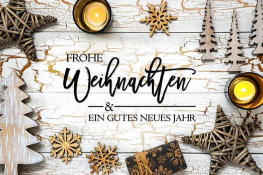 German Text Which Means Merry Christmas And A Happy New Year. White Wooden Vintage Christmas Background With Christmas Decoration Like Candle, Tree, Snowflake, Stars and Gift.