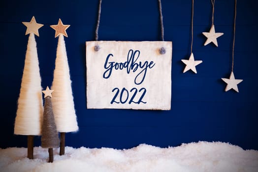 Christmas Decoration Like White Tree With Star On Blue Background. White Snow On Ground. Sign With English Calligraphy Goodbye 2022