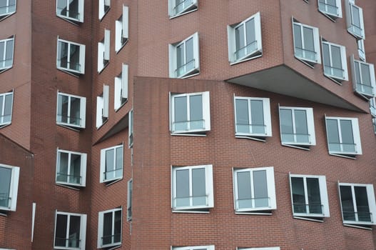 Interlocking clinker facade of the Gehry buildings at the Media Harbor in Dusseldorf, Germany