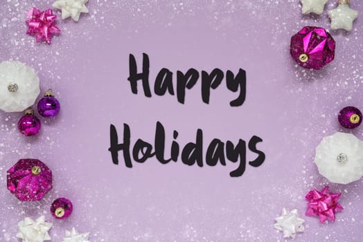 Christmas Card With English Text Happy Holidays. Purple Christmas Background With Romantic And Brilliant Decoration Like Balls And Snowflakes