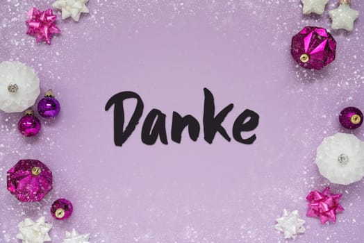 Christmas Card With German Text Danke Means Thank You. Purple Christmas Background With Romantic And Brilliant Decoration Like Balls And Snowflakes