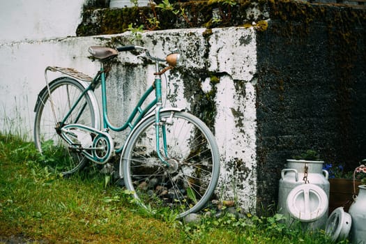 Old Rarity Bicycle Parked Next To Old Wall In Village.