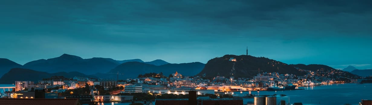 Alesund, Norway. Night Alesund Skyline Cityscape. Historical Center In Summer Evening. Famous Norwegian Landmark And Popular Destination. Alesund, Kiven viewpoint, Mt. Panorama Panoramic View