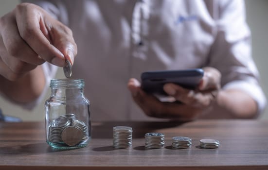 Save money and account banking for finance concept, Piggy bank with coin on blurred background, Save Monney for Investors Using Internet to Trade Stocks or Trade Fund