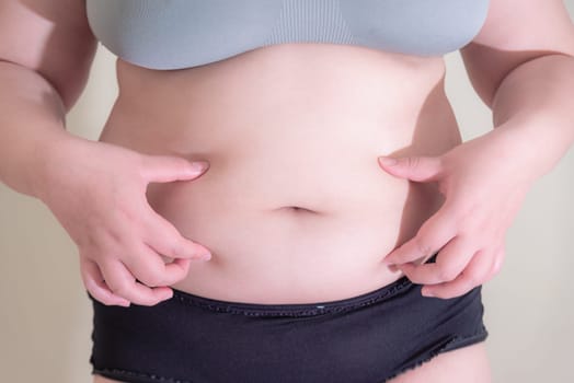 Fat woman, Shape up healthy stomach muscle, and diet lifestyle, to reduce belly concept.