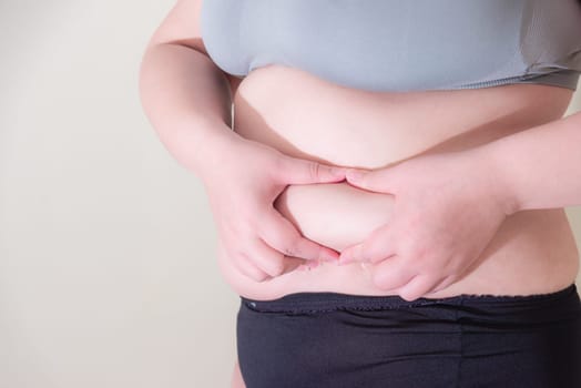 Fat woman, Shape up healthy stomach muscle, and diet lifestyle, to reduce belly concept.