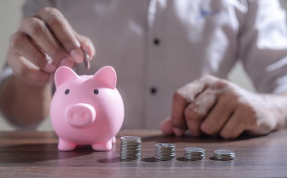 Save money and account banking for finance concept, Piggy bank with coin on blurred background, Save Monney for Investors Using Internet to Trade Stocks or Trade Fund