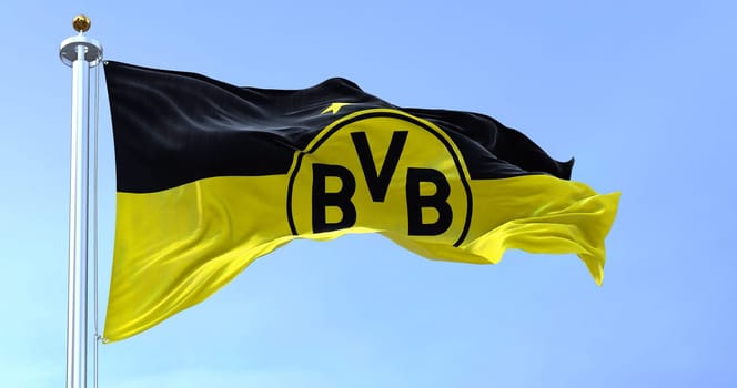 Dortmund, GER, September 2022: The flag of Borussia Dortmund waving in the wind. Borussia Dortmund is a German professional sports club based in Dortmund.