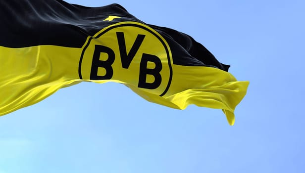 Dortmund, GER, September 2022: The flag of Borussia Dortmund waving in the wind. Borussia Dortmund is a German professional sports club based in Dortmund.
