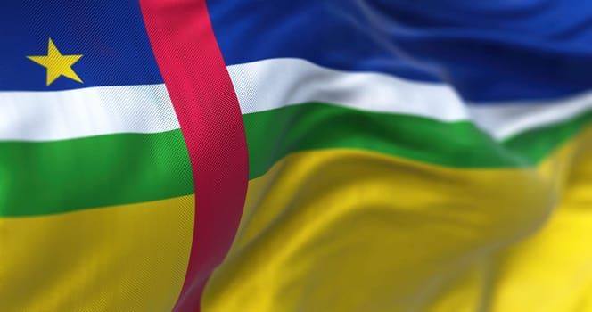 Close-up view of the Central African Republic national flag waving in the wind. Fabric textured background. Selective focus