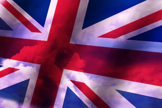 Waving the national flag of Great Britain against the background of blue and red clouds