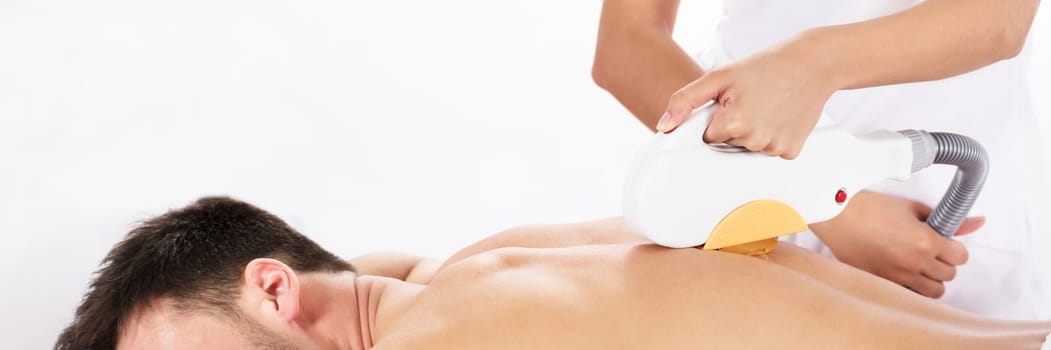 Hair Removal Cosmetology Procedure From A Therapist At Cosmetic Beauty Spa Clinic
