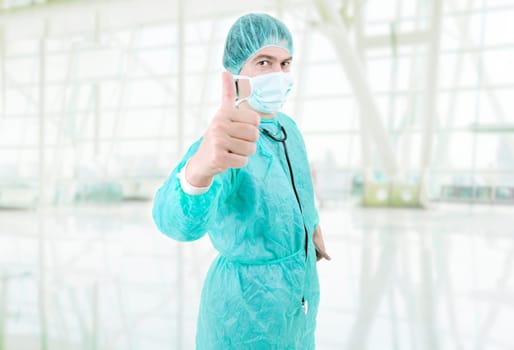 young male doctor going thumb up at the hospital