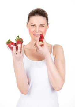woman with white dress holding some strawberries.