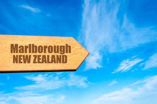Wooden arrow sign pointing destination Marlborough, NEW ZEALAND  against clear blue sky with copy space available. Travel destination concept  image