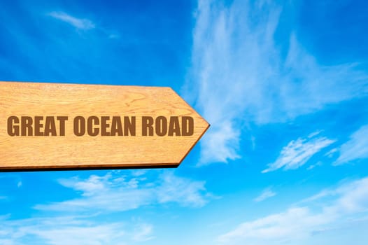 Wooden arrow sign pointing destination GREAT OCEAN ROAD, AUSTRALIA  against clear blue sky with copy space available. Travel destination concept  image