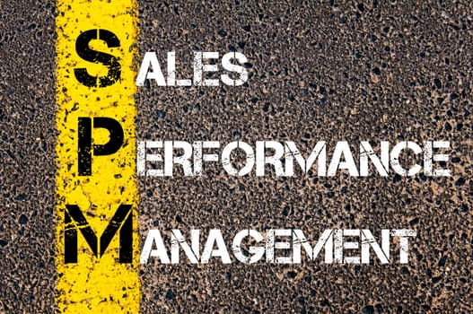 Concept image of Business Acronym SPM as SALES PERFORMANCE MANAGEMENT written over road marking yellow paint line.