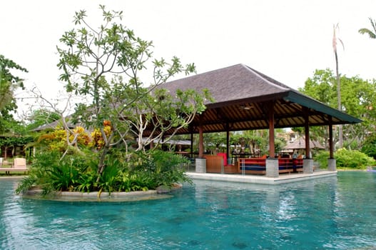 View of tropical resort swimming pool scene in morning