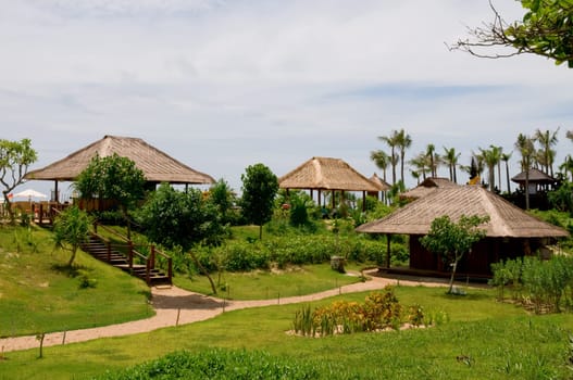 Huts in green field of India