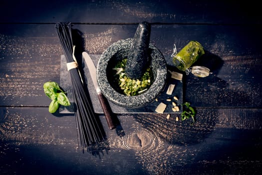 black spaghetti and pesto alla genovese,pesto with basil,garlic,parmesan,pine nuts and olive oil