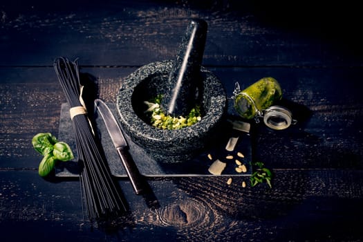 black spaghetti and pesto alla genovese,pesto with basil,garlic,parmesan,pine nuts and olive oil