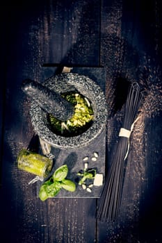 black spaghetti and pesto alla genovese,pesto with basil,garlic,parmesan,pine nuts and olive oil