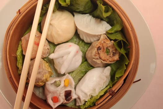 asian wontons in wooden bowl