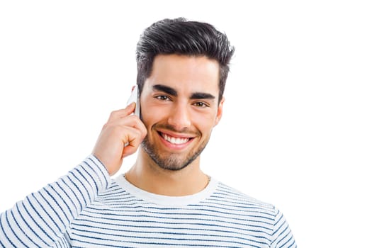 Happy and handsome young man talking at phone, isolated on white background