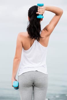 Beautiful young woman in outdoor doing yoga