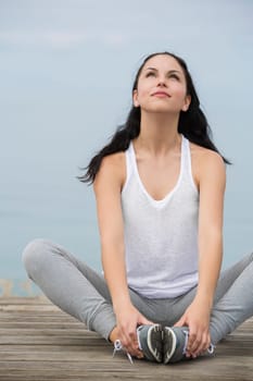 Beautiful young woman in outdoor doing yoga