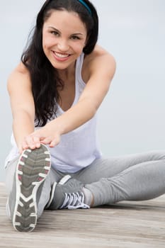 Beautiful young woman in outdoor doing yoga