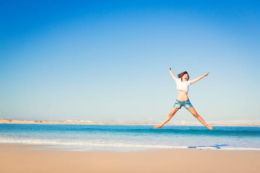 Beautiful young woman enjoying the beach