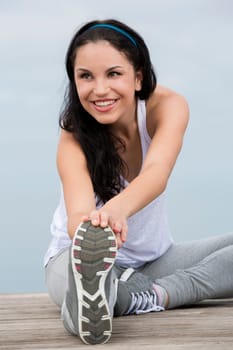 Beautiful young woman in outdoor doing yoga