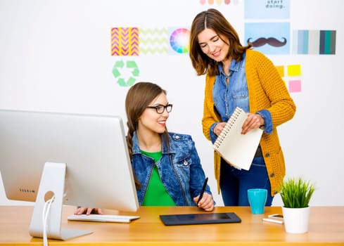Women working at desk In a creative office, team work