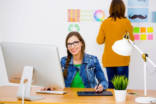 Women working at desk In a creative office, team work