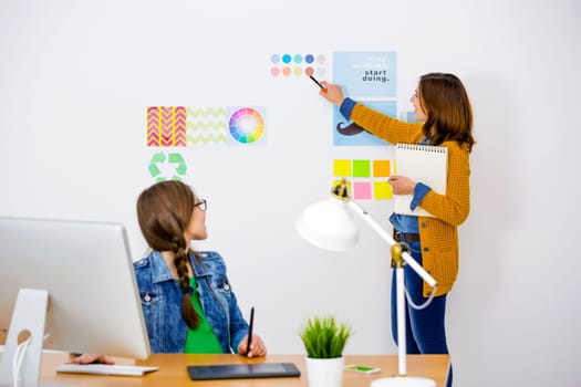 Women working at desk In a creative office, team work