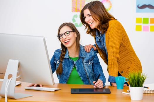 Women working at desk In a creative office, team work