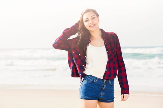 Portrtait of a happy girl at the beach enjoying the life